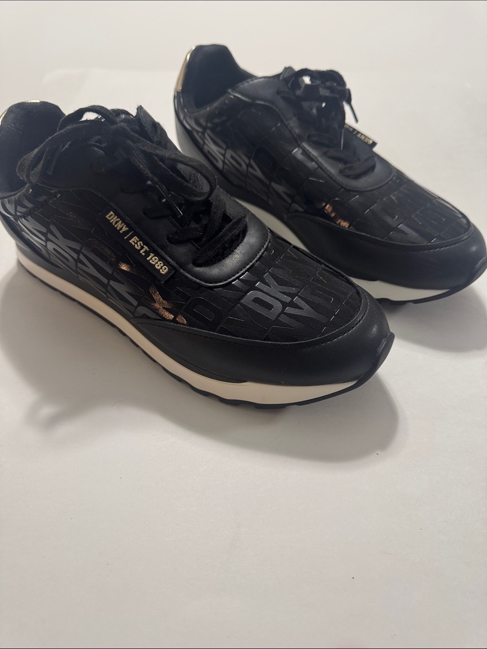 DKNY Black Sneakers with Gold Accent and Cream Midsole